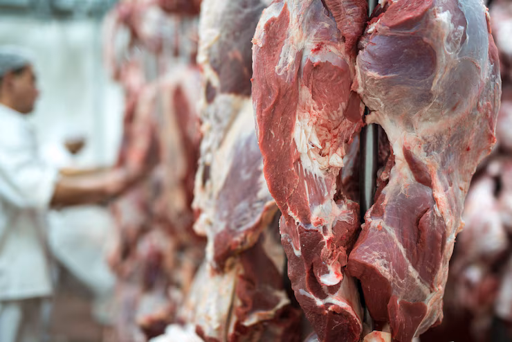 fresh-red-meet-butchery-worker-working-background_342744-662